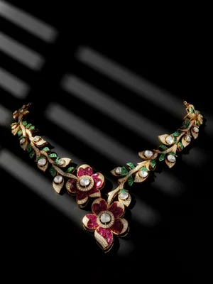 Ruby and emerald floral necklace on black