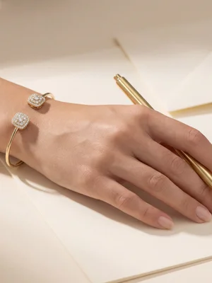 White-metal bangle on a wrist while writing