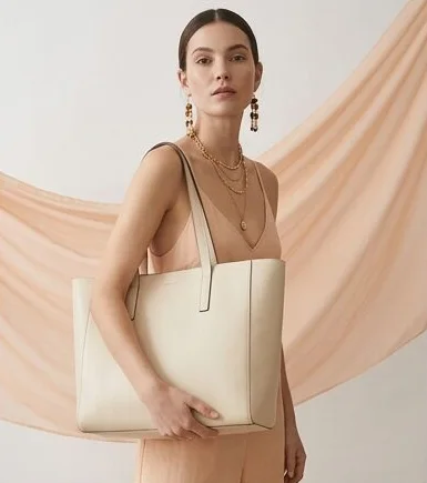 Accessories look on a model against a draped linen backdrop, an AI photoshoot by Kaptured.AI