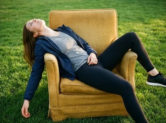 Activewear look on a model lounging in a garden armchair, shot with AI