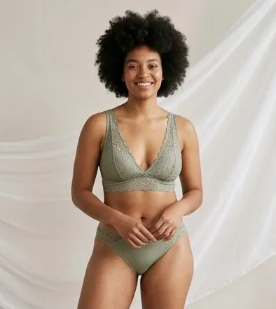 Lingerie look on a model against a draped linen backdrop, an AI photoshoot by Kaptured.AI