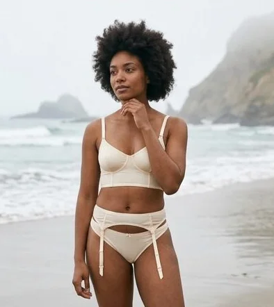 Lingerie look on a model on a misty rocky coastline, an AI photoshoot by Kaptured.AI