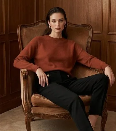 Luxury look on a model seated in a leather armchair indoors, an AI photoshoot by Kaptured.AI