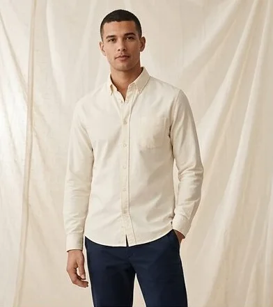 Menswear look on a model against a draped linen backdrop, an AI photoshoot by Kaptured.AI