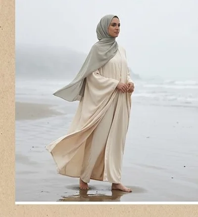 Modest wear look on a model on a misty rocky coastline, an AI photoshoot by Kaptured.AI