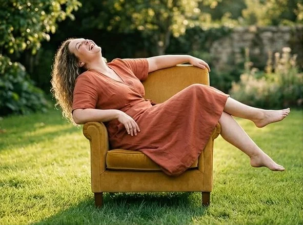 Plus-size look on a model lounging in a garden armchair, shot with AI
