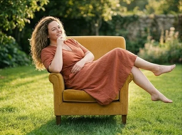 The same plus-size look in a second armchair pose, shot with AI