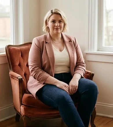 Plus-size look on a model seated in a leather armchair indoors, an AI photoshoot by Kaptured.AI
