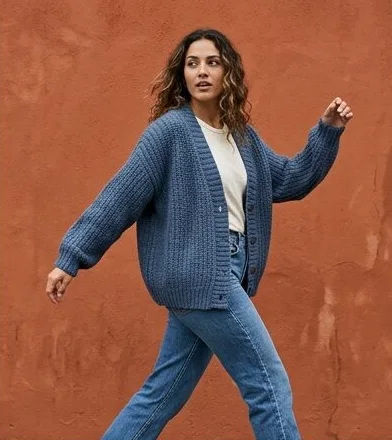Sustainable fashion look on a model moving past a terracotta wall, an AI photoshoot by Kaptured.AI