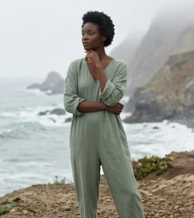 Sustainable fashion look on a model on a misty rocky coastline, an AI photoshoot by Kaptured.AI