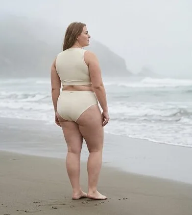 Swimwear look on a model on a misty rocky coastline, an AI photoshoot by Kaptured.AI