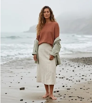 Womenswear look on a model on a misty rocky coastline, an AI photoshoot by Kaptured.AI
