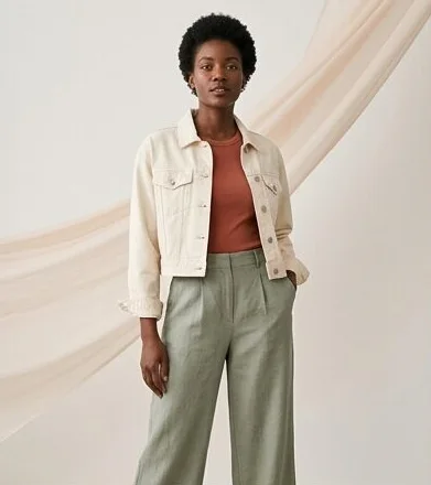 Cream jacket and sage trousers against a draped backdrop, shot with AI